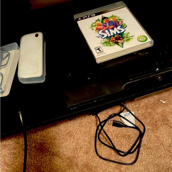 playstation 3 console with game and accessories